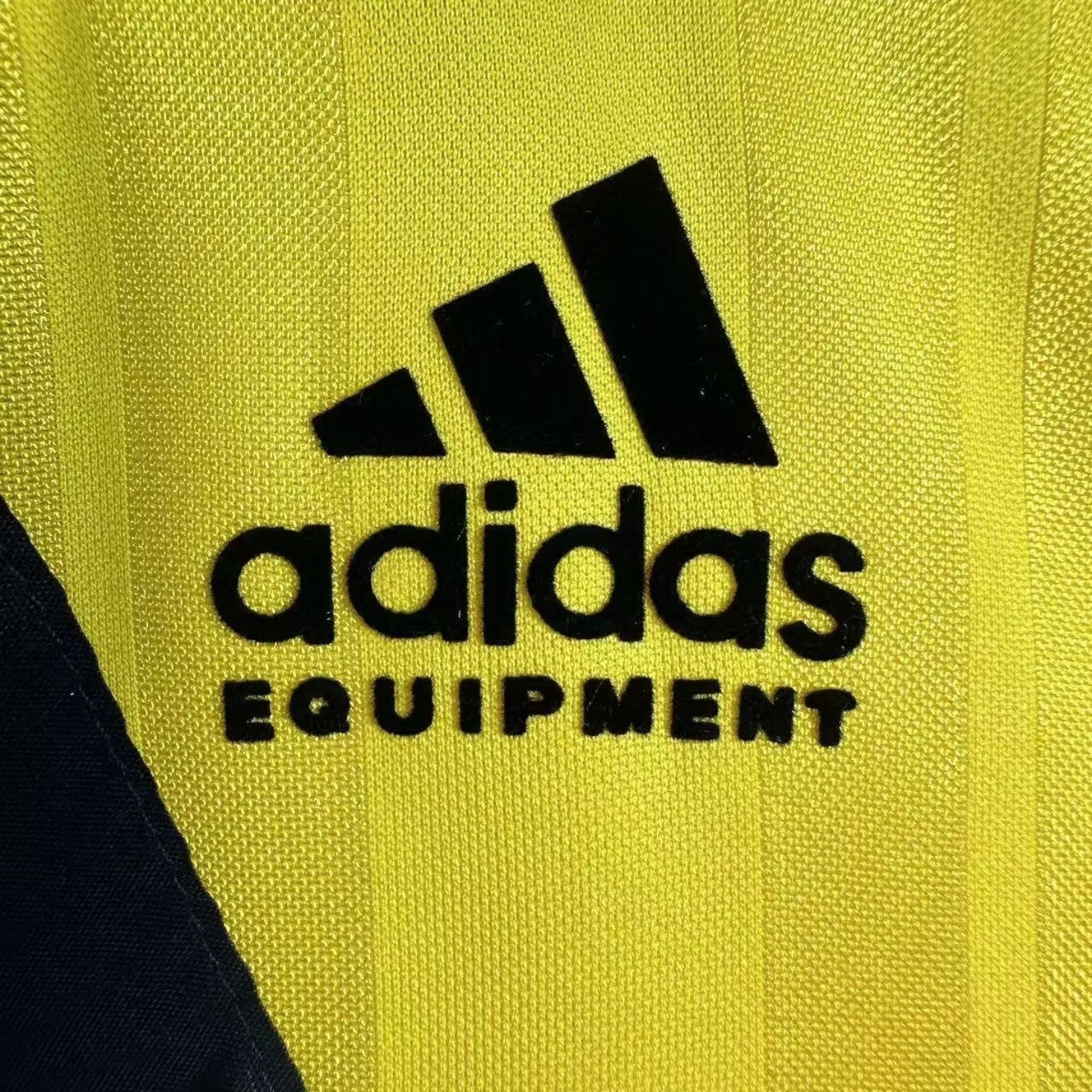 Elite Retro Kits Arsenal 1993/94 away shirt featuring the classic black adidas Equipment logo on yellow fabric