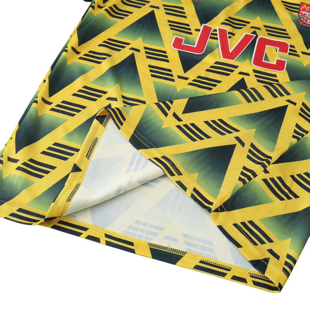 Elite Retro Kits Arsenal 1991-93 Bruised Banana away shirt featuring a yellow base with jagged navy geometric patterns.