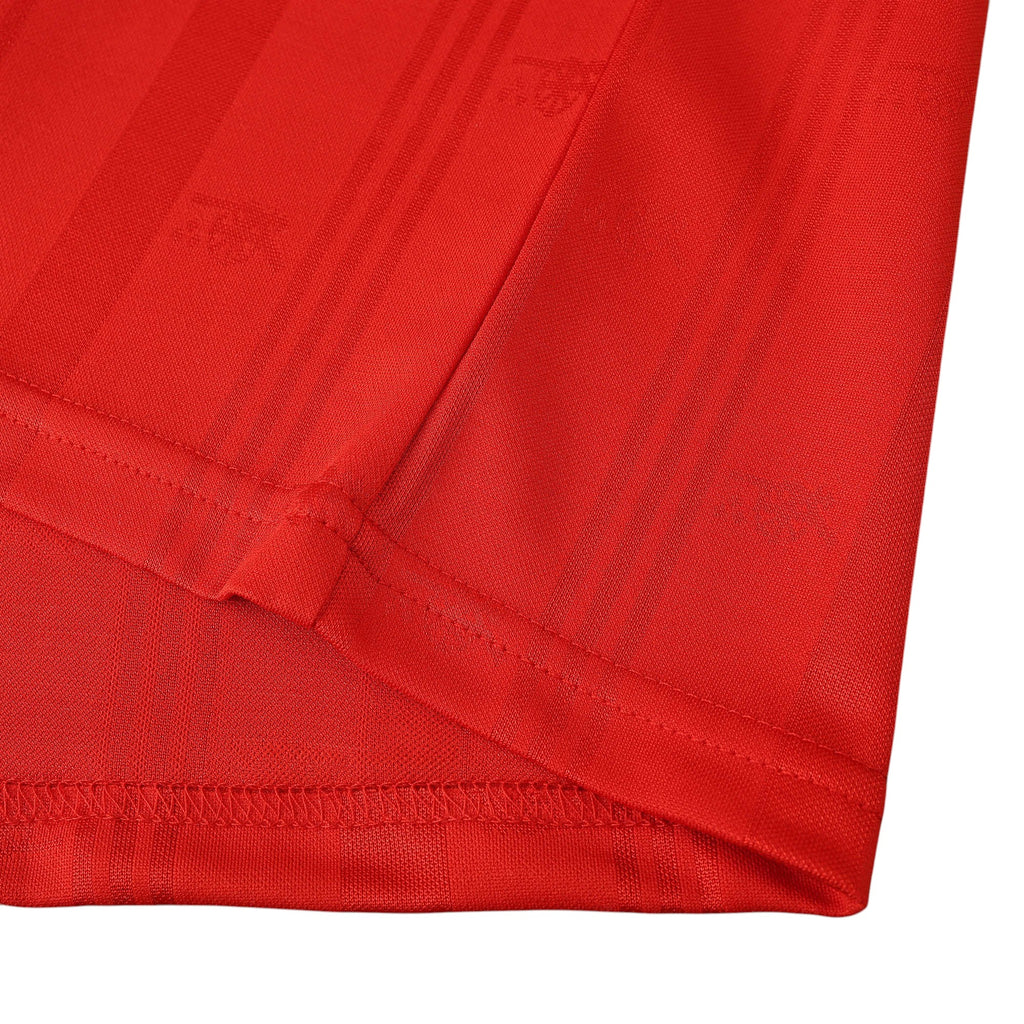 Elite Retro Kits Arsenal 1988/90 home shirt featuring a red fabric with subtle tonal vertical stripes and texture.