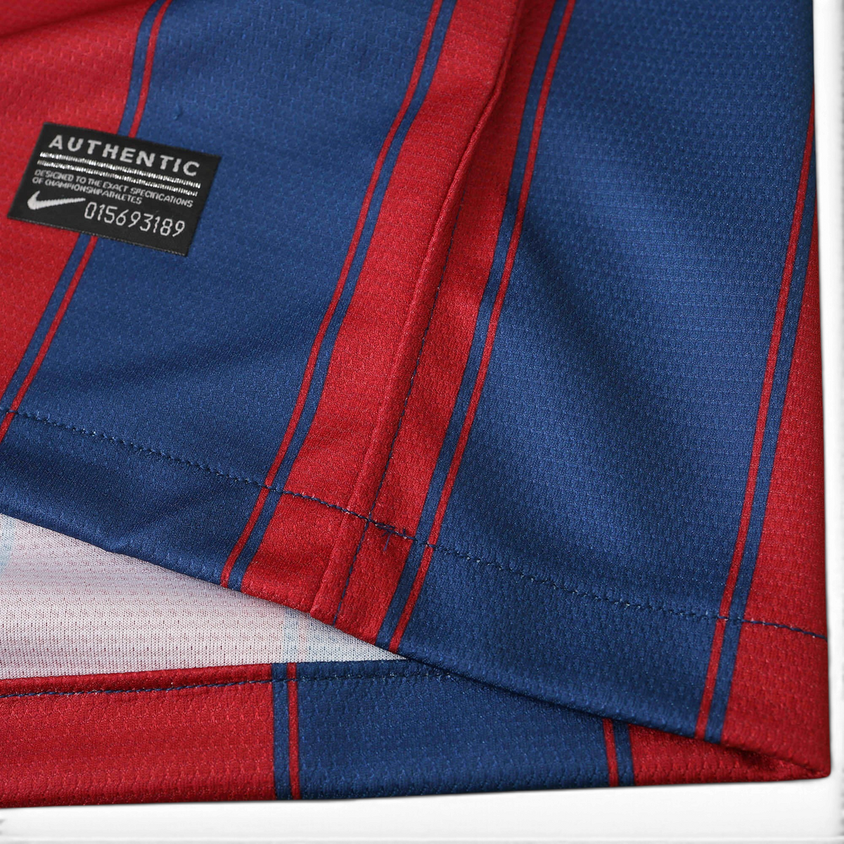 Elite Retro Kits Barcelona 2009/10 home shirt featuring blue and maroon stripes and an authentic Nike label detail.