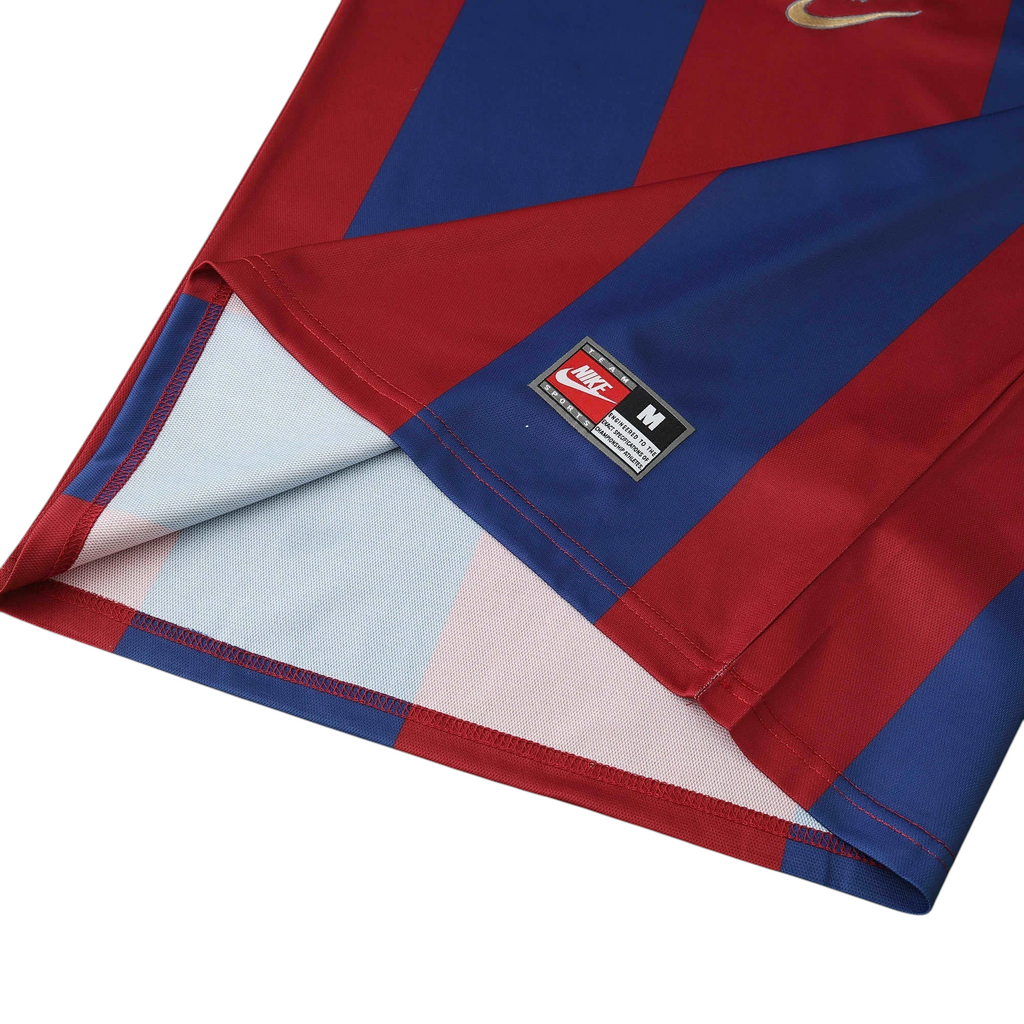 Elite Retro Kits Barcelona 1998-00 away shirt featuring blue and maroon stripes with a Nike team tag on the hem