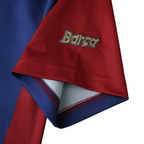Elite Retro Kits Barcelona 1998-00 away shirt sleeve detail featuring Barca embroidery on maroon fabric