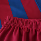 Elite Retro Kits kids Barcelona 2005/06 home kit featuring blue and maroon striped jersey and matching maroon shorts