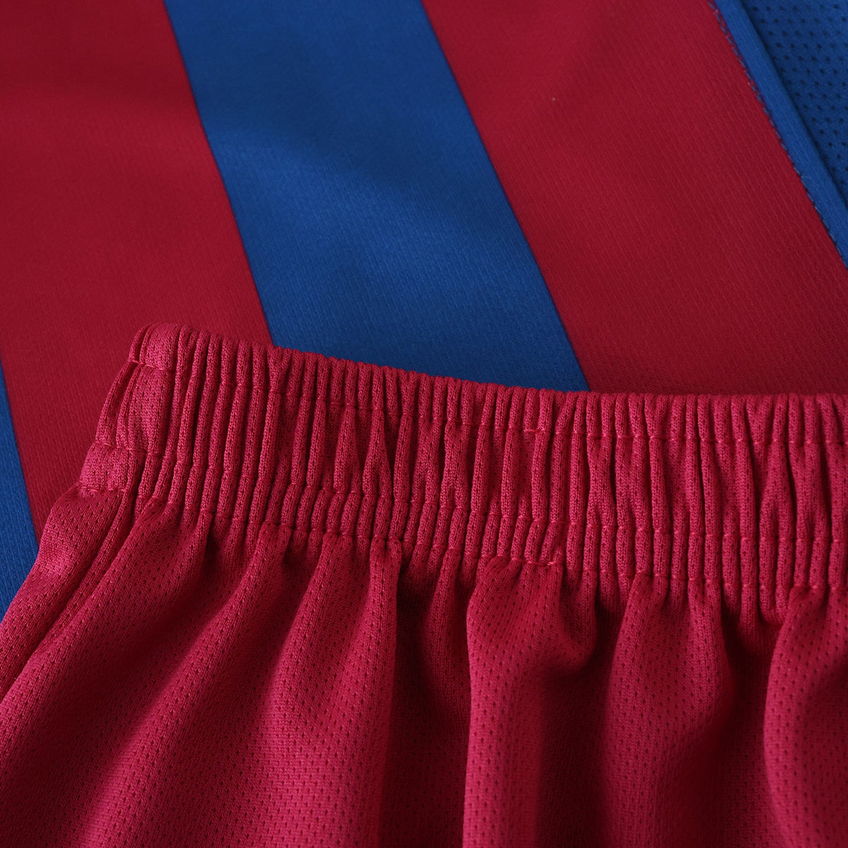 Elite Retro Kits kids Barcelona 2005/06 home kit featuring blue and maroon striped jersey and matching maroon shorts