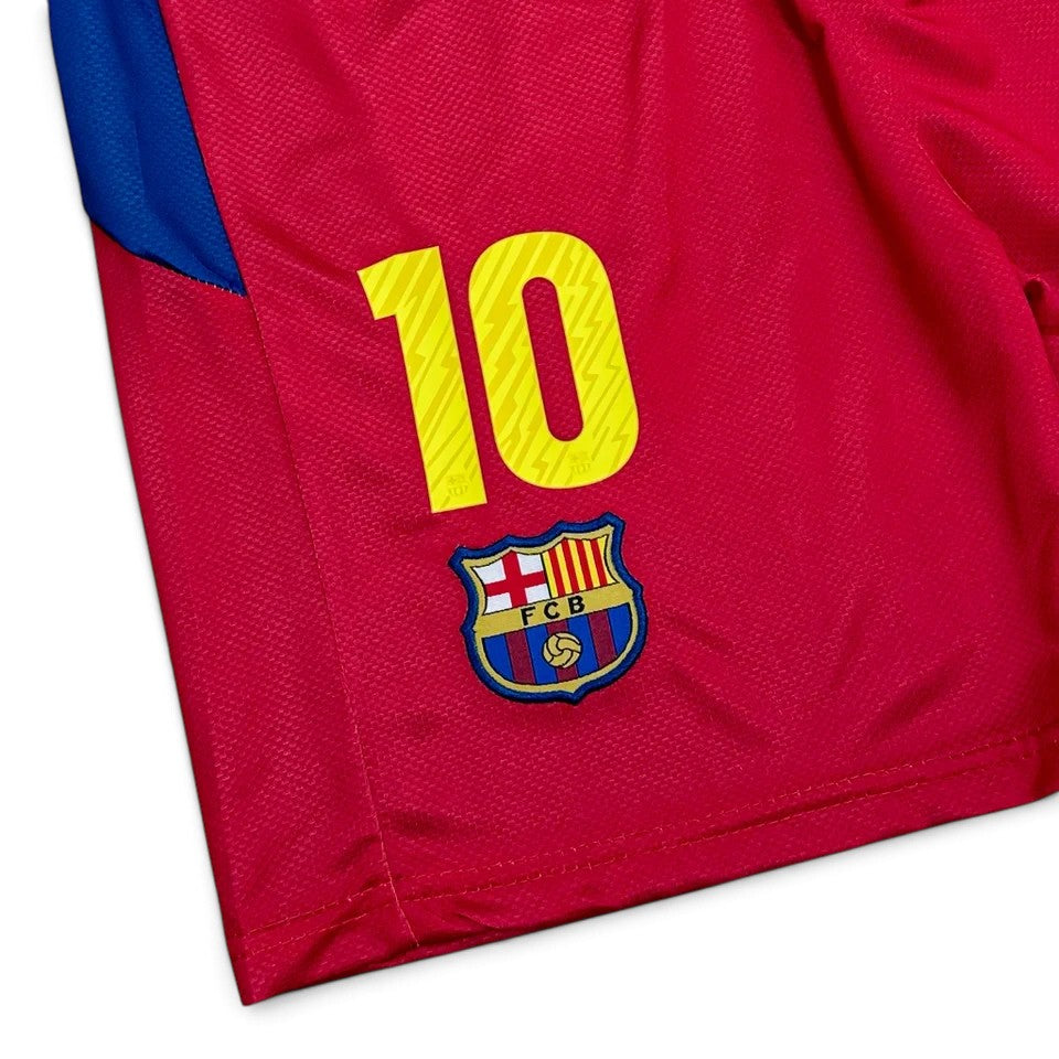 Elite Retro Kits Barcelona 2010/11 kids home shorts in red with blue trim, featuring number 10 and FCB club crest.