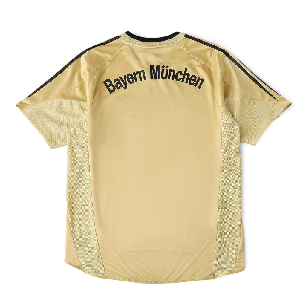 Back view of Elite Retro Kits Bayern Munich 2004/05 away football shirt in gold with black lettering and trim.