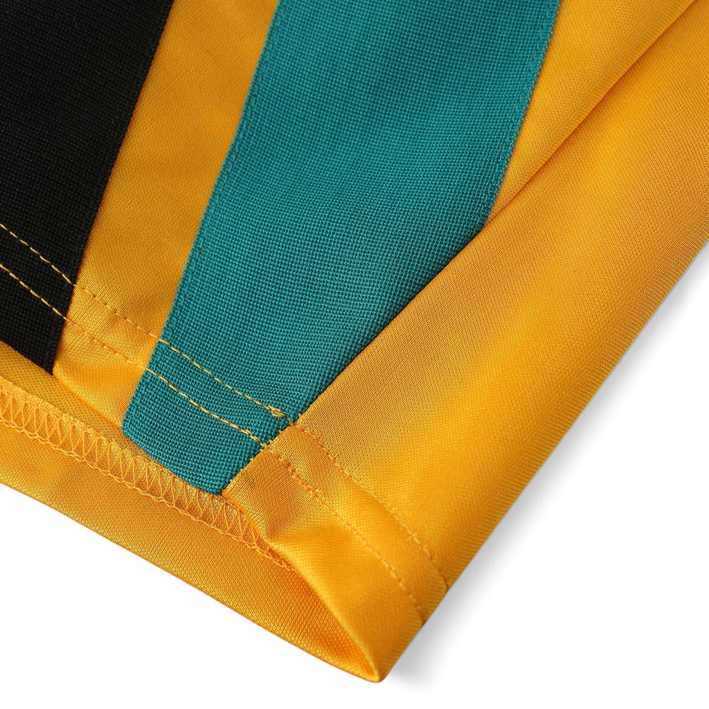 Elite Retro Kits Bayern Munich 1993/95 away jersey sleeve detail in yellow, teal, and black fabric