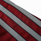 Close-up of the Elite Retro Kits Bayern Munich 1998/99 away shirt featuring maroon and grey striped fabric texture.