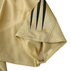 Elite Retro Kits Bayern Munich 2004/05 away shirt sleeve detail in gold mesh fabric with black three-stripe accents.