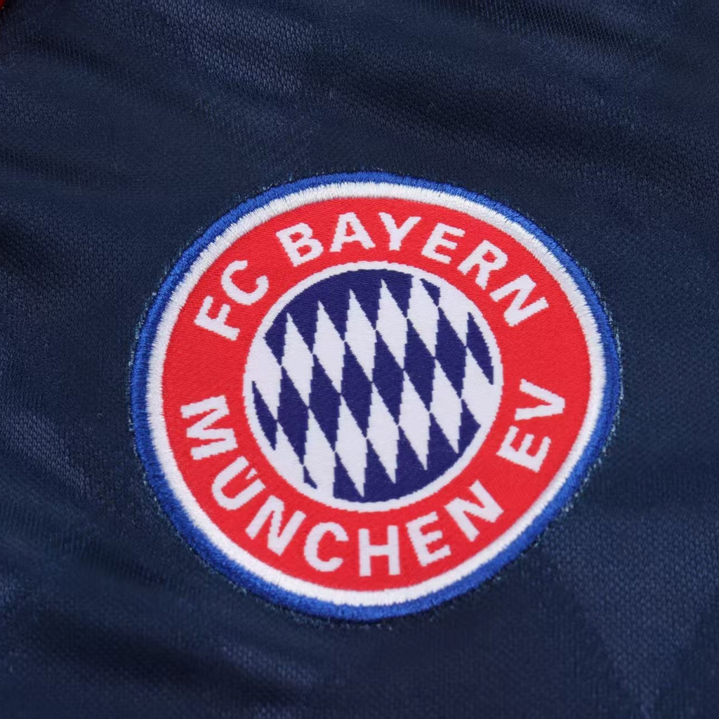 Elite Retro Kits Bayern Munich 1997/99 kids football kit featuring the embroidered club crest on navy fabric