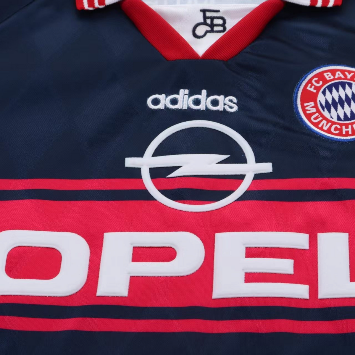 Elite Retro Kits Bayern Munich 1997-99 kids away jersey featuring the classic navy, red, and white Opel sponsor logo.