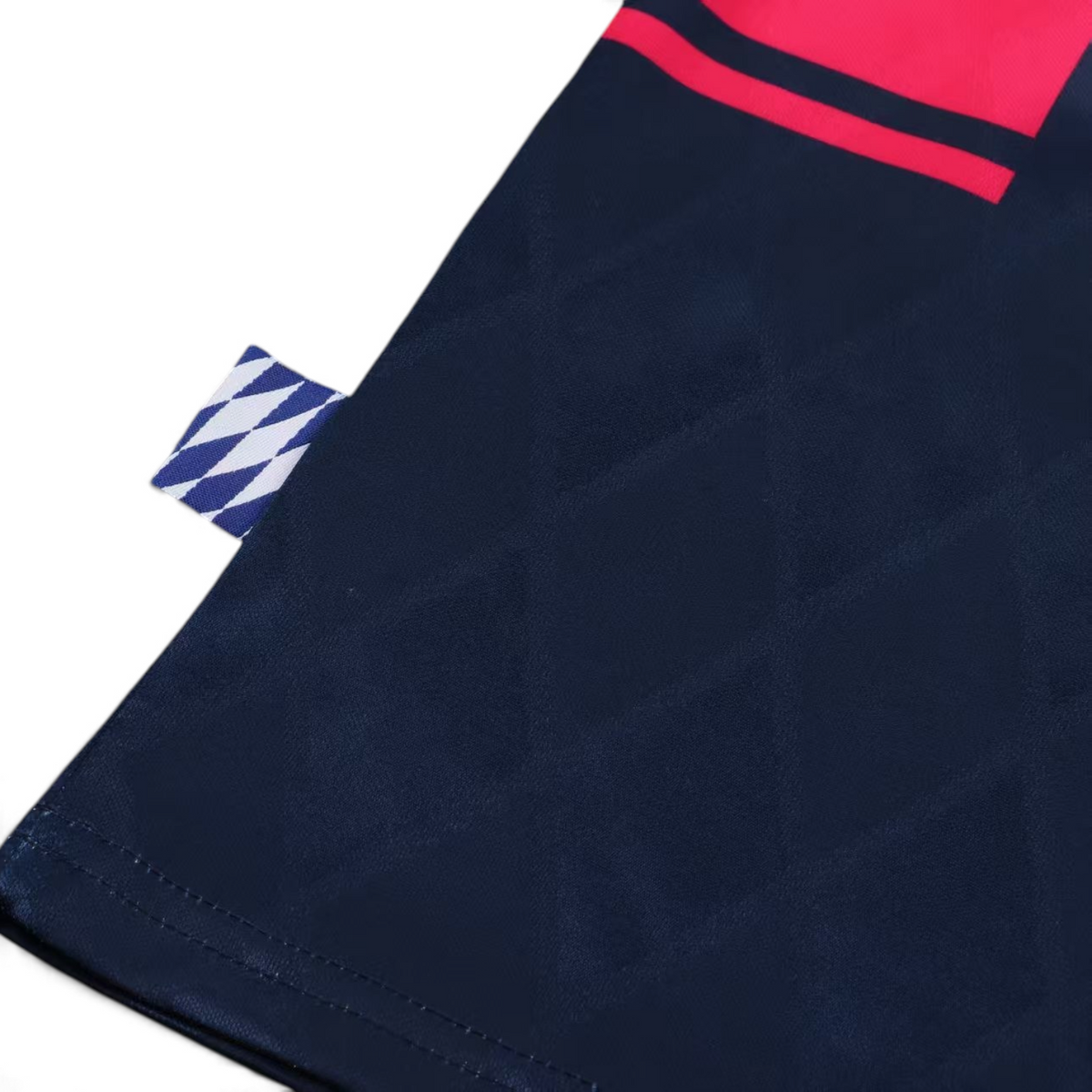 Elite Retro Kits Bayern Munich 1997/99 kids away kit detail showing navy fabric with diamond pattern and woven tab