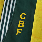 Elite Retro Kits Brazil 1992 home shirt detail showing the green collar with yellow CBF lettering and fabric pattern.