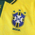 Elite Retro Kits Brazil 1992 home shirt featuring a yellow fabric with a subtle pattern, green collar, and CBF crest.