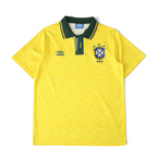 Elite Retro Kits Brazil 1992 home football shirt in yellow with a green buttoned collar and subtle fabric pattern.