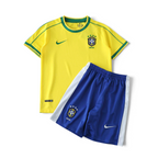 Elite Retro Kits Brazil 1998 kids home football kit featuring a yellow jersey with green trim and blue shorts.