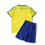 Elite Retro Kits Brazil 1998 kids home kit featuring a yellow jersey with green trim and blue shorts