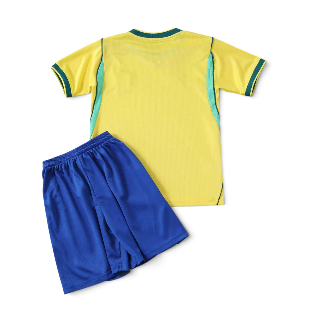 Elite Retro Kits Brazil 2026 kids home football kit featuring a yellow jersey with green trim and blue shorts.
