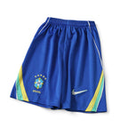 Elite Retro Kits Brazil 2026 kids football shorts in blue with green and yellow side accents and CBF team crest.