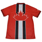 Elite Retro Kits 1998 Canada home football shirt in red with a central maple leaf graphic and fold-over collar.