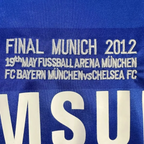 Elite Retro Kits Chelsea 2011/12 UCL Final home shirt detail featuring embroidered Munich 2012 match text in blue