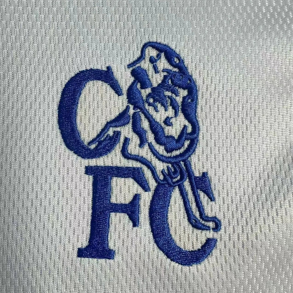 Elite Retro Kits Chelsea 2003-05 away shirt featuring a detailed blue embroidered CFC lion crest on silver fabric.