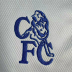 Elite Retro Kits Chelsea 2003-05 away shirt featuring a detailed blue embroidered CFC lion crest on silver fabric.