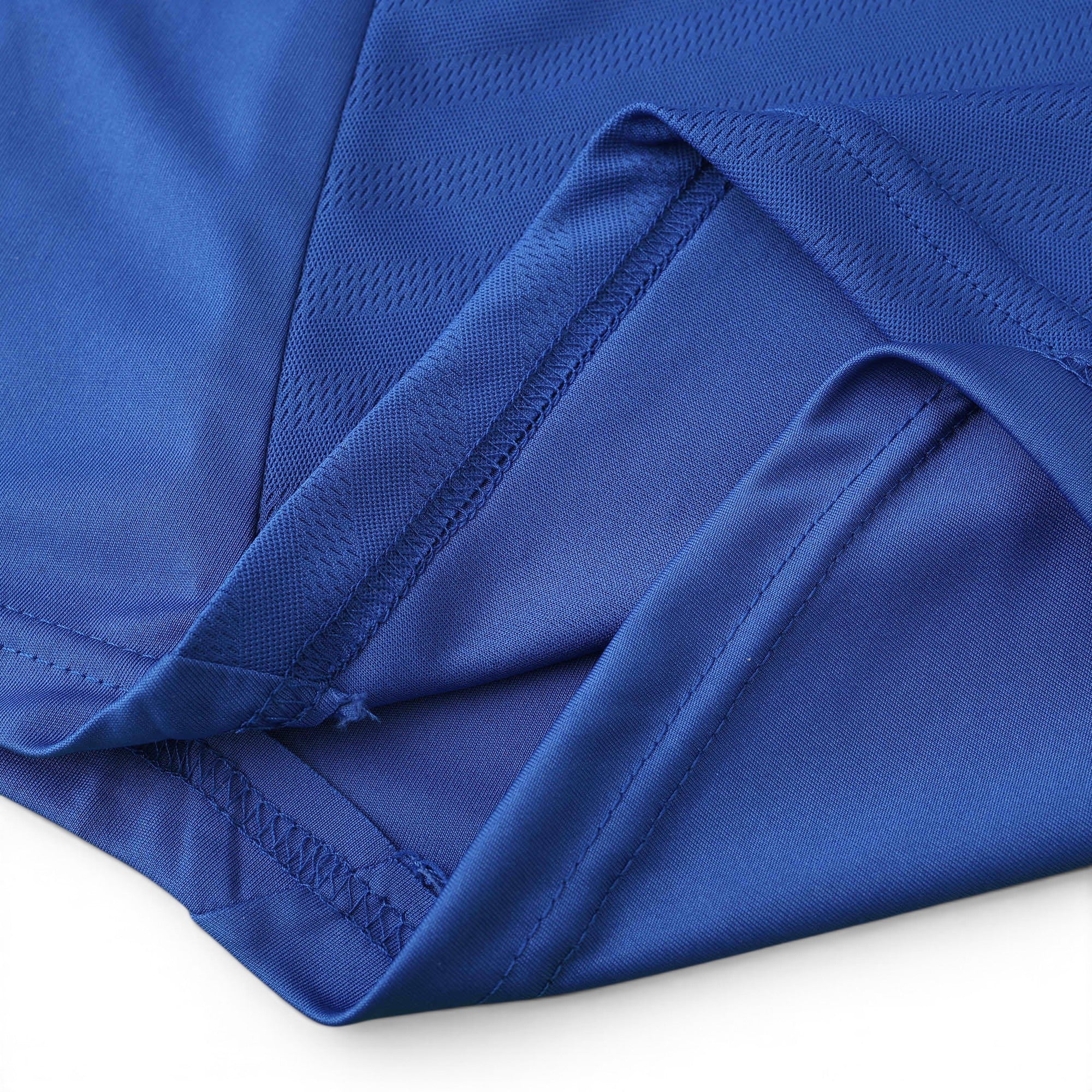 Close-up of Elite Retro Kits Chelsea 2012/13 home shirt fabric showing blue textured material and stitched hem detail.