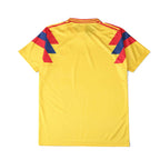 Elite Retro Kits Colombia 1990 home football shirt in bright yellow with red and blue shoulder detailing, back view.
