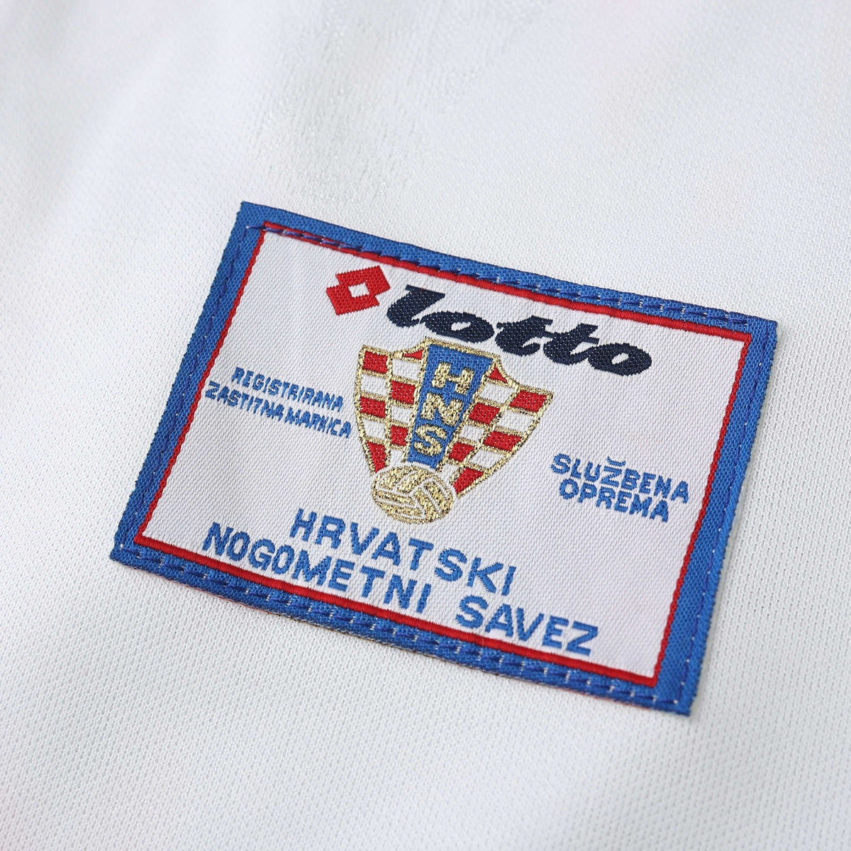Elite Retro Kits Croatia 1998 home shirt detail showing the embroidered Lotto and HNS federation logo patch