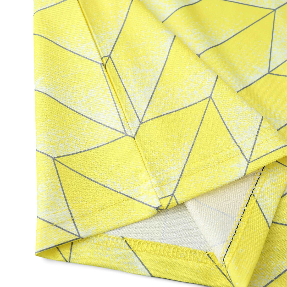 Close-up of the yellow and grey geometric pattern on an Elite Retro Kits Borussia Dortmund 1988/89 home shirt hem.