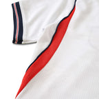 Elite Retro Kits England 2026 World Cup kids home shirt featuring white fabric with red mesh side panels and trim.