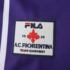 Elite Retro Kits Fiorentina 1999/00 home shirt featuring the iconic red giglio crest and Fila logo on purple fabric