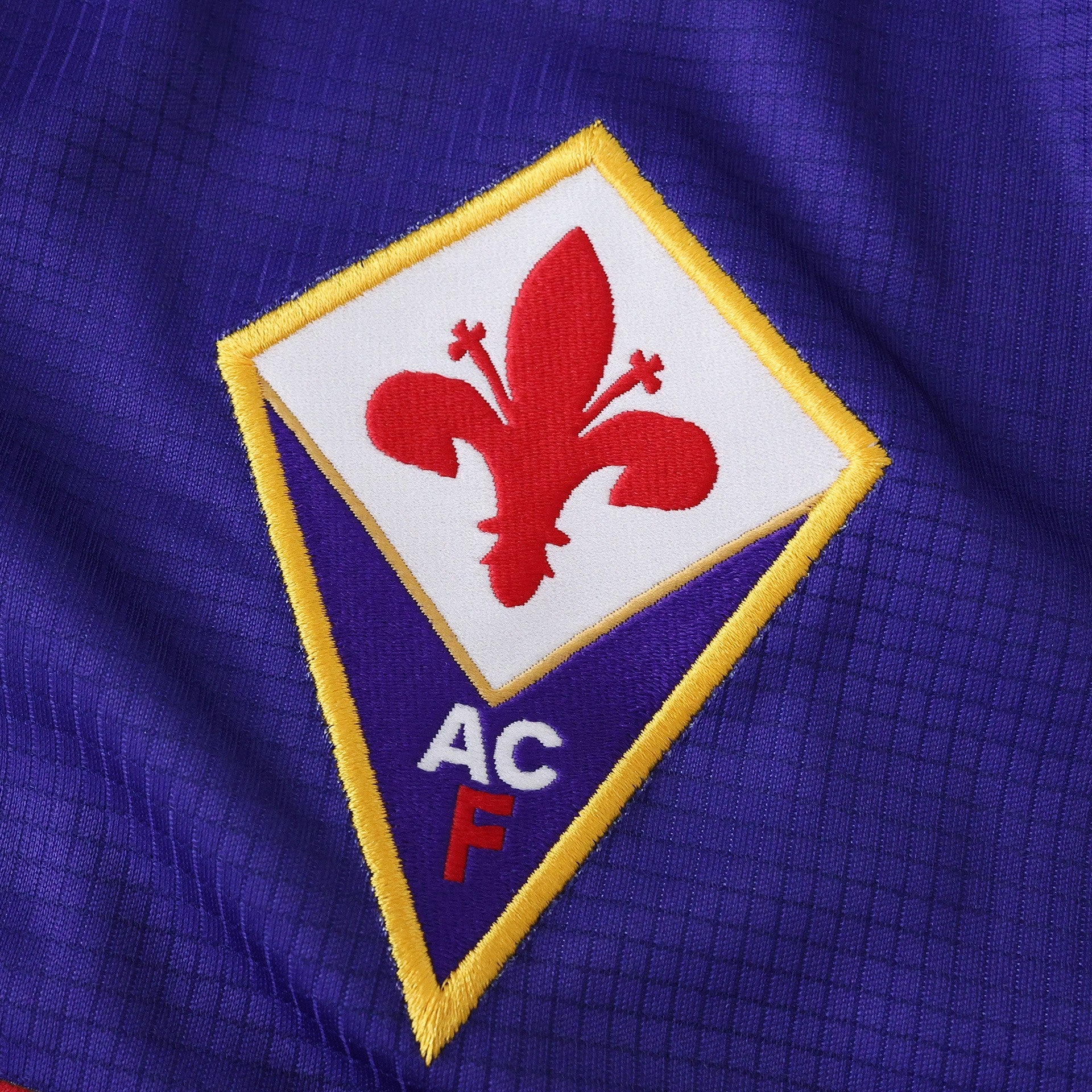 Elite Retro Kits Fiorentina 1998/99 home shirt featuring the iconic purple fabric and embroidered red giglio crest.