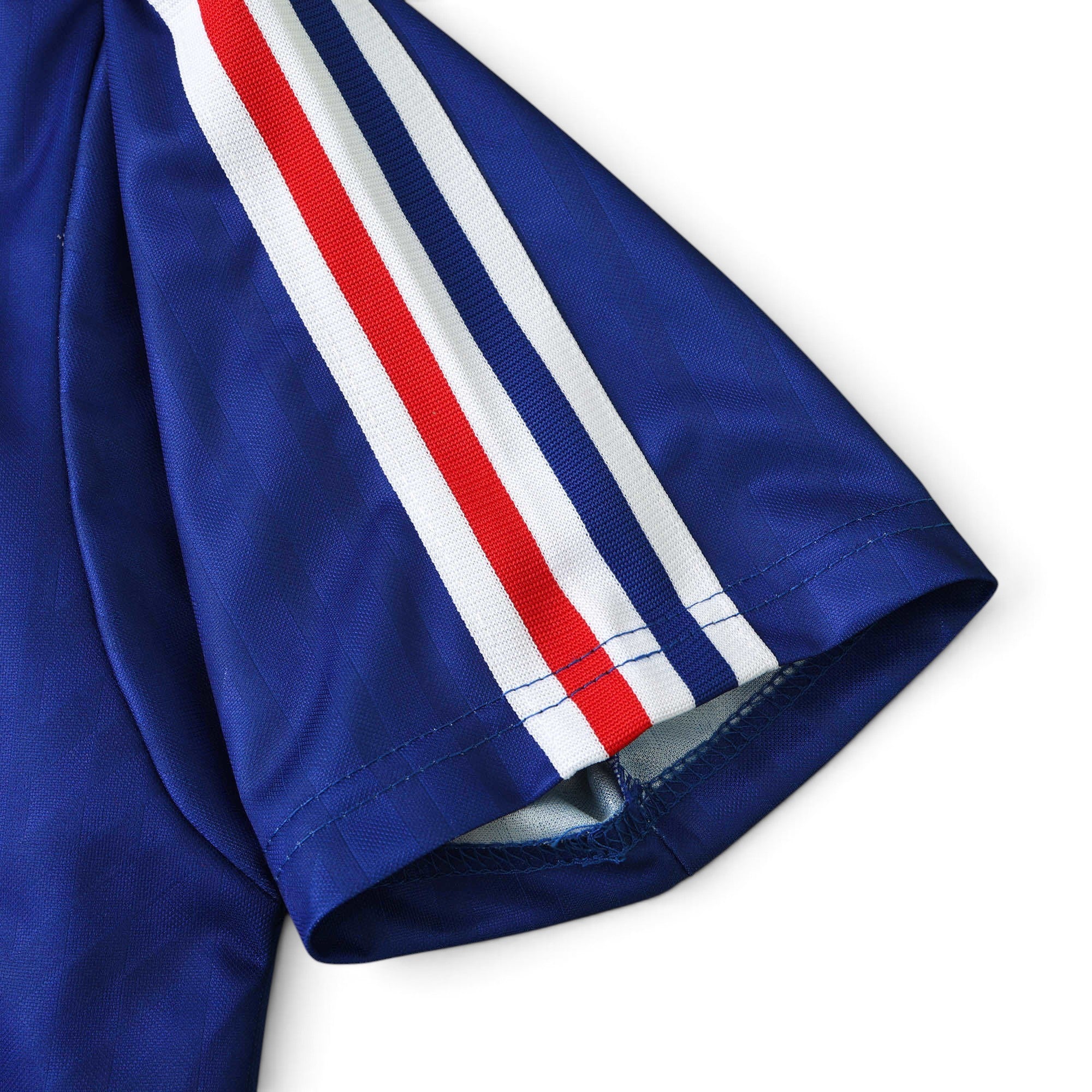 Elite Retro Kits France 1994 home football shirt sleeve detail featuring blue fabric with red and white stripes