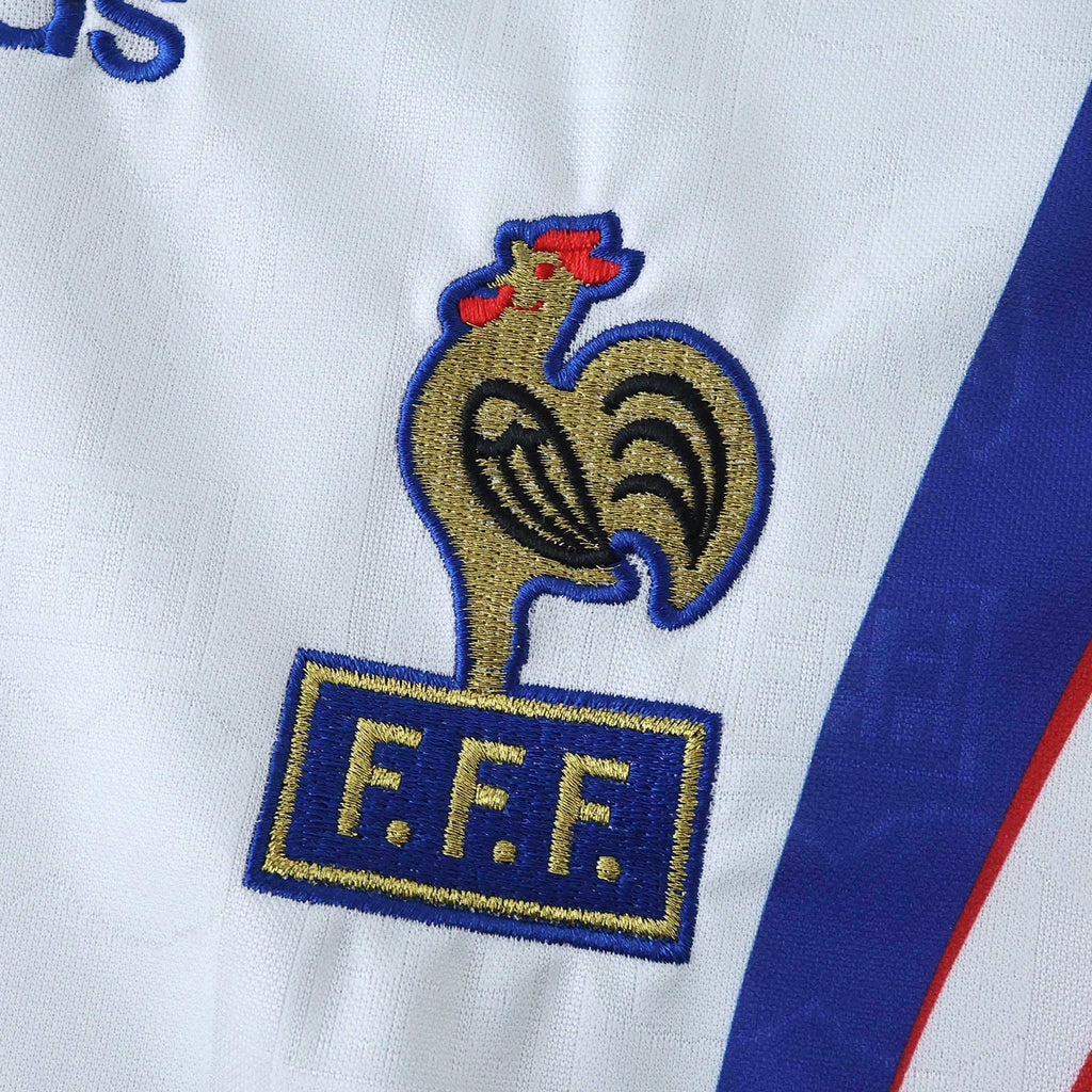 Elite Retro Kits France 1996 away football shirt featuring a detailed embroidered FFF cockerel crest on white fabric