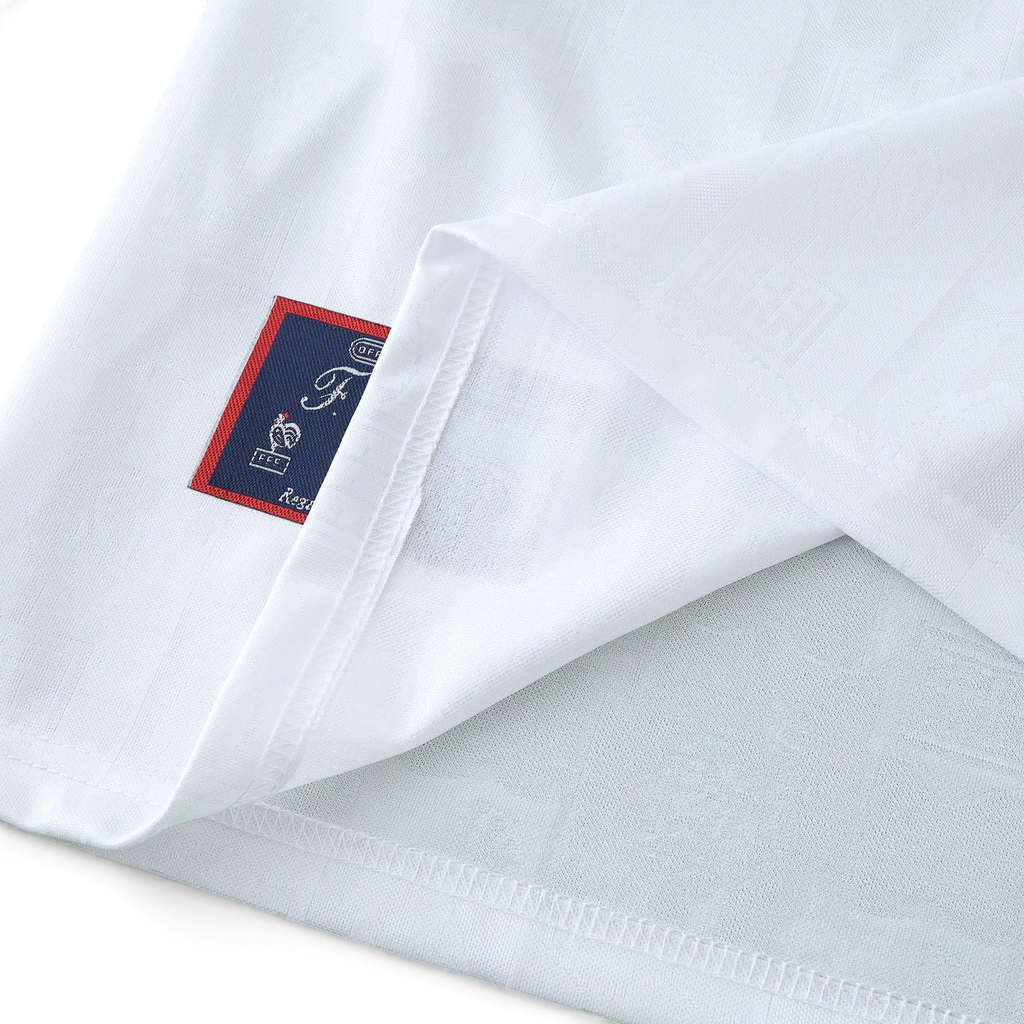 Elite Retro Kits France 1996 away shirt in white with a detailed embroidered cockerel emblem on the hem tag