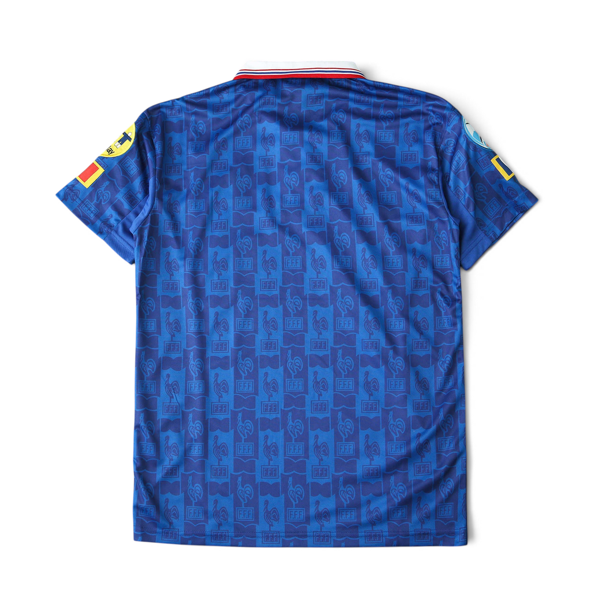 Back view of Elite Retro Kits France 1996 home football shirt in blue with repeating FFF logo pattern and collar