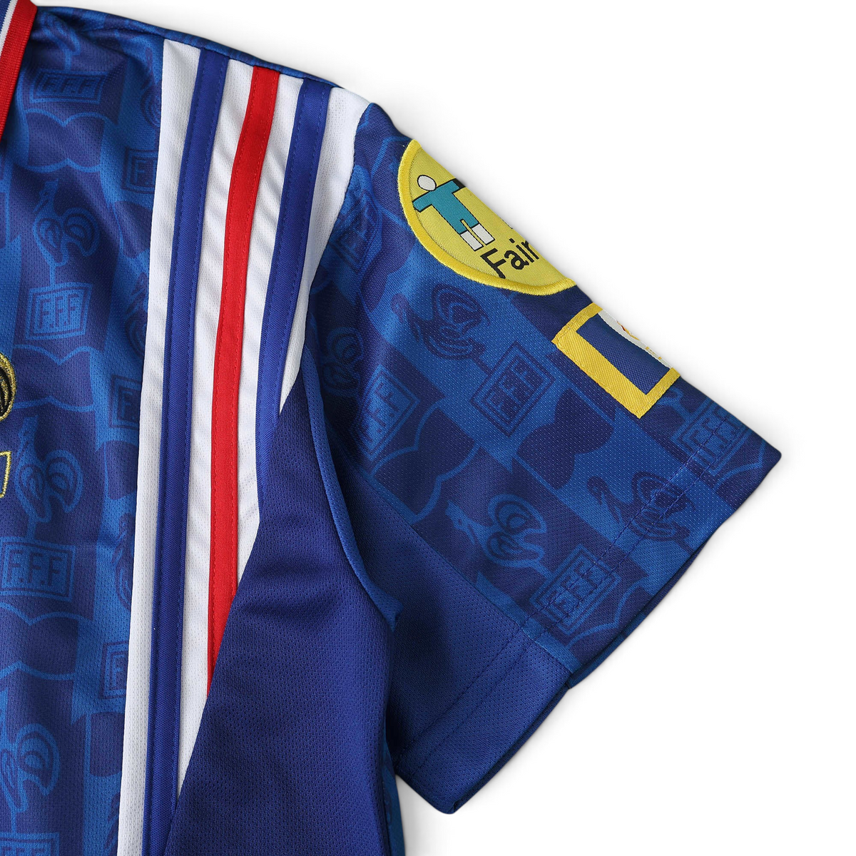 Elite Retro Kits France 1996 home shirt sleeve detail featuring blue fabric with red and white tricolore stripes