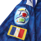 Elite Retro Kits France 1996 home shirt sleeve detail featuring the Euro 96 tournament patch and French flag emblem.