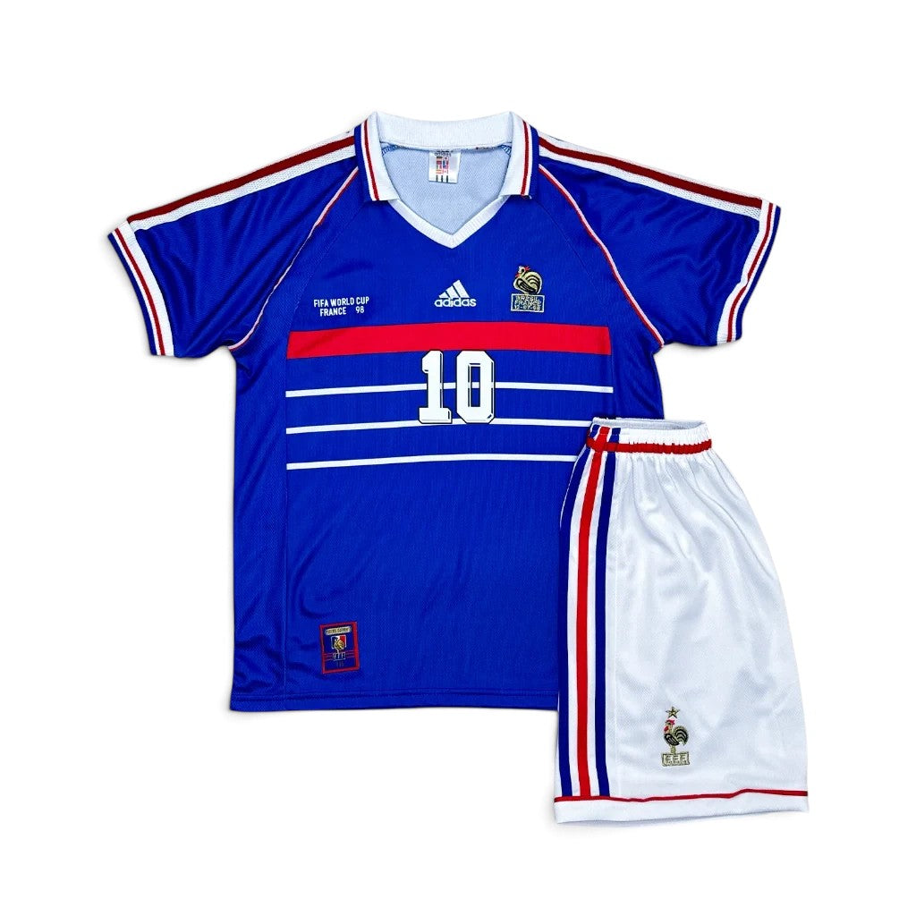 Elite Retro Kits France 1998 World Cup kids home kit featuring a blue jersey with number 10 and white tricolour shorts.