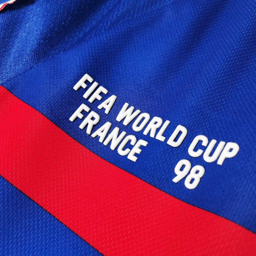 Elite Retro Kits France 1998 World Cup home shirt detail featuring white text on deep blue and red fabric