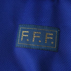 Elite Retro Kits France 1998 World Cup home shirt detail featuring the gold F.F.F. emblem on deep blue fabric