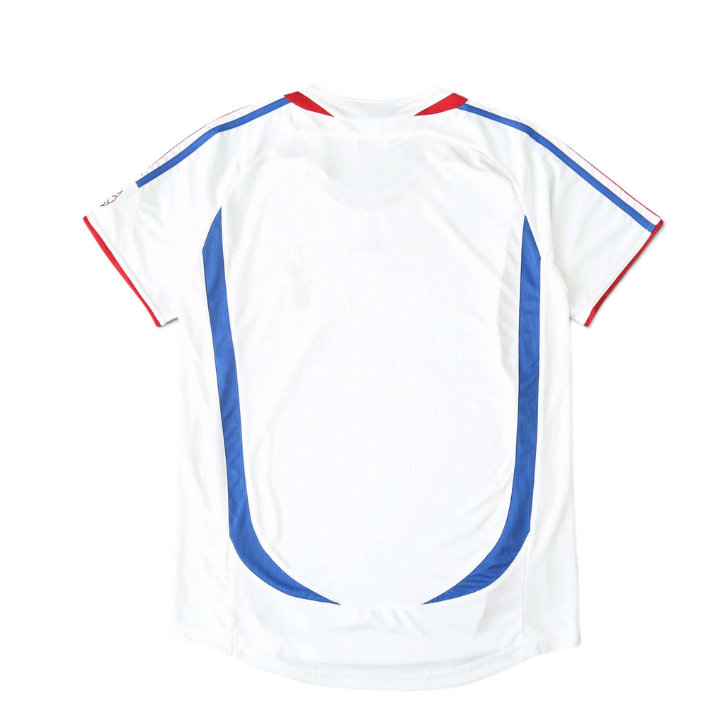 Elite Retro Kits France 2006 away football shirt in white with blue side panels and red trim, back view.