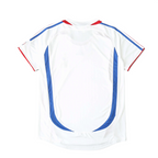 Elite Retro Kits France 2006 away football shirt in white with blue side panels and red trim, back view.