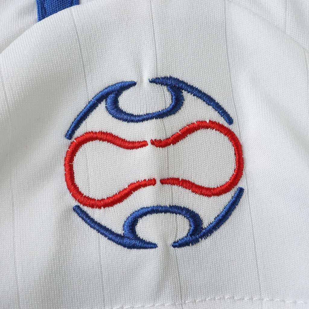 Elite Retro Kits France 2006 away shirt featuring detailed red and blue embroidered logo on white textured fabric