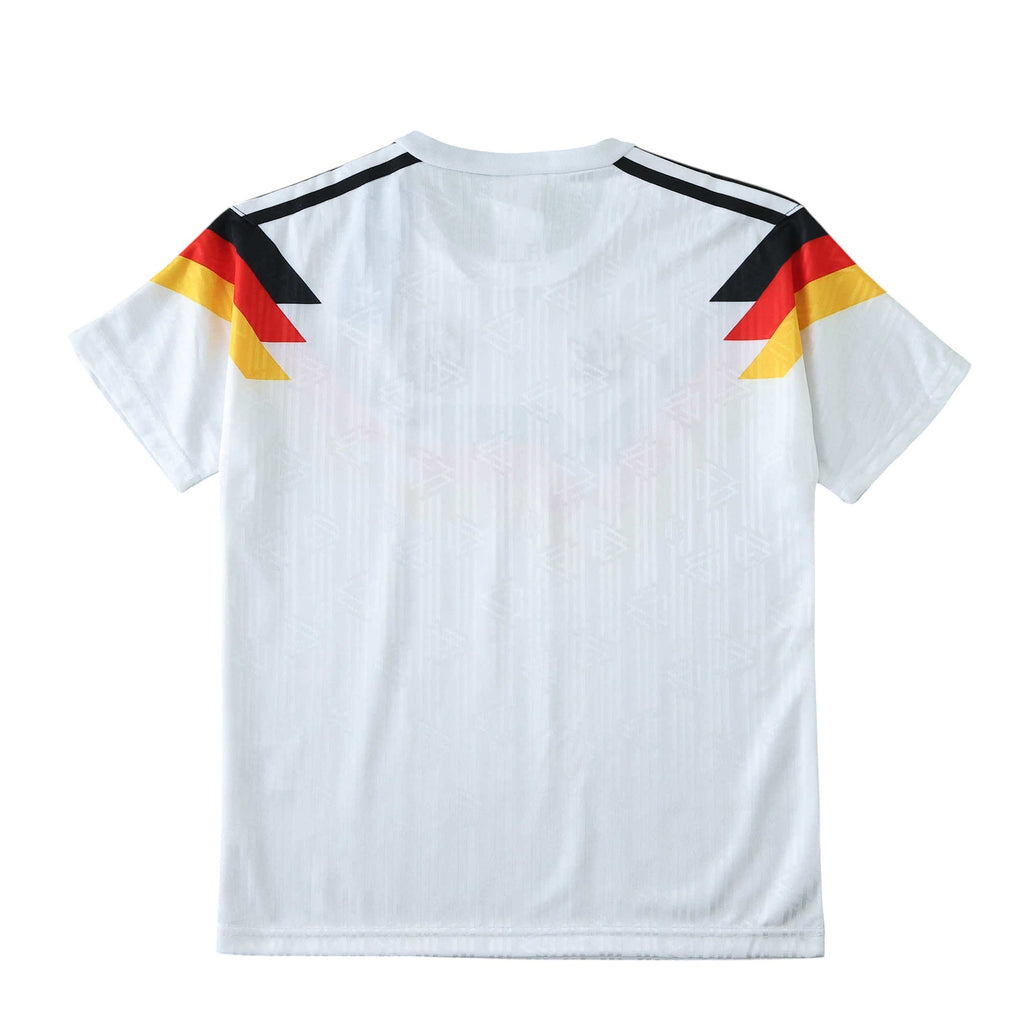 Elite Retro Kits Germany 1990 World Cup kids home jersey in white with iconic black, red, and gold shoulder graphic.