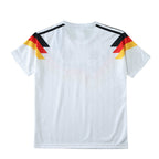 Elite Retro Kits Germany 1990 World Cup kids home jersey in white with iconic black, red, and gold shoulder graphic.