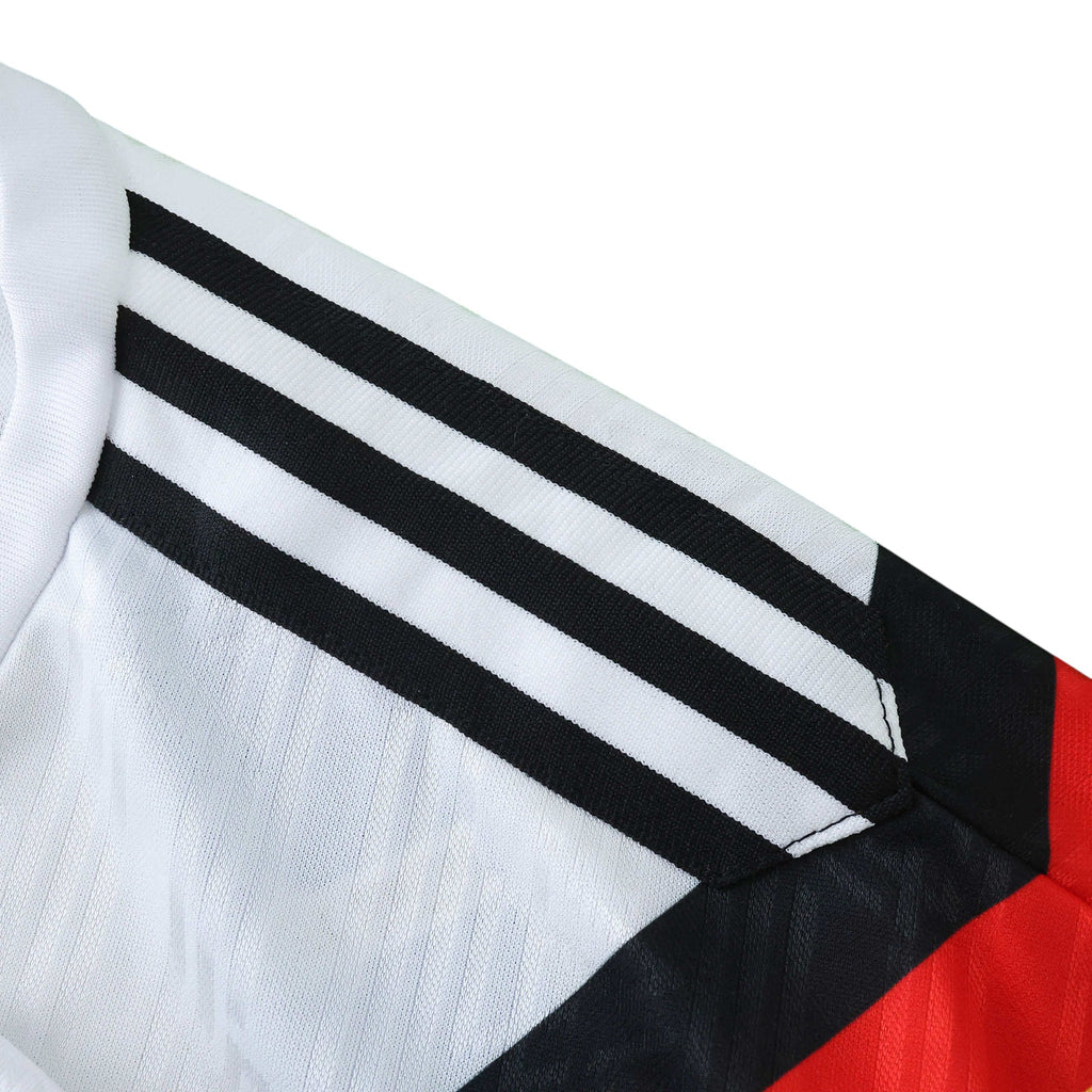 Elite Retro Kits Germany 1990 World Cup kids home kit featuring iconic black, red, and gold graphic on white fabric