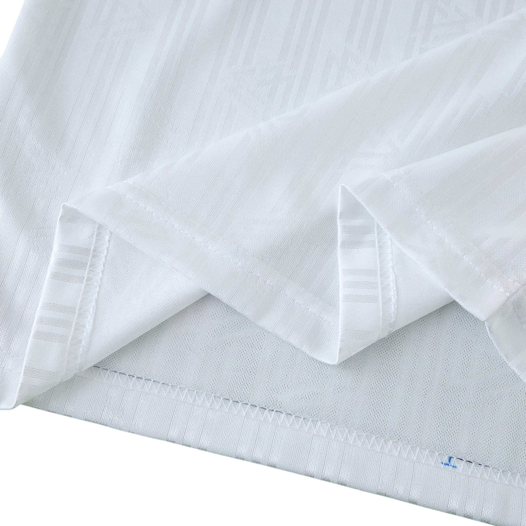 Elite Retro Kits Germany 1990 World Cup kids home kit white fabric with subtle tonal pinstripe texture